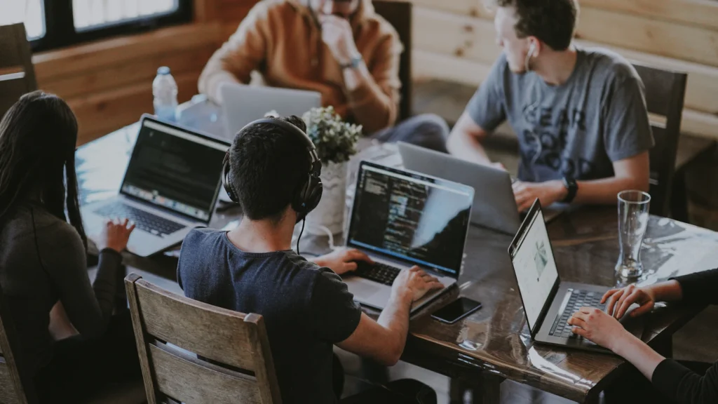 Colleagues using connected technology in a collaborative office
