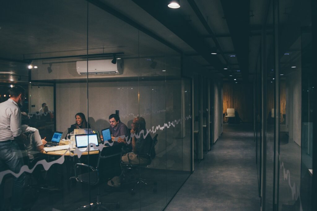 Colleagues discussing business IT requirements in a modern office