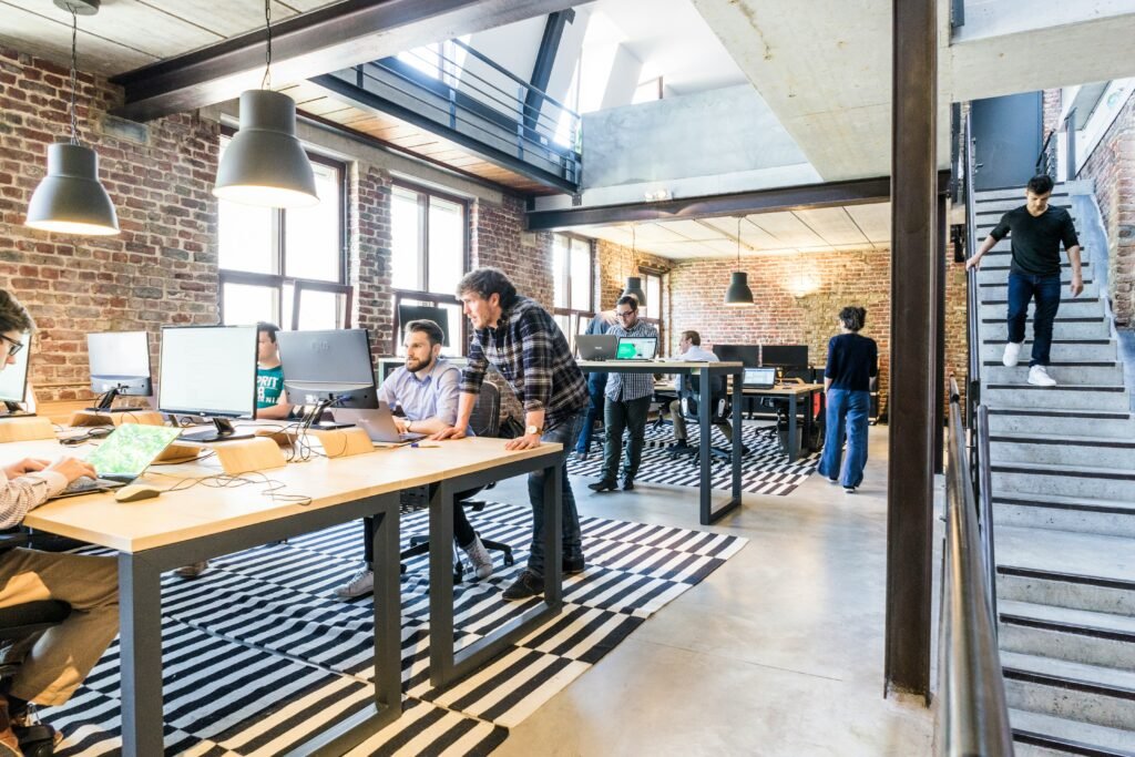 Two business professionals discussing IT systems in a modern office