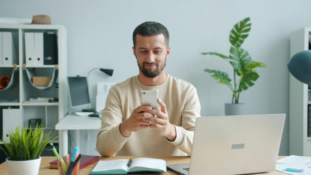 Business professional using a smartphone at work