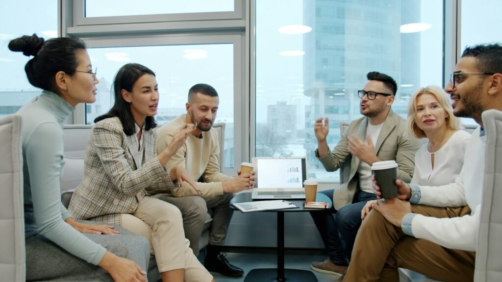 Business professionals discussing technology requirements together in an office