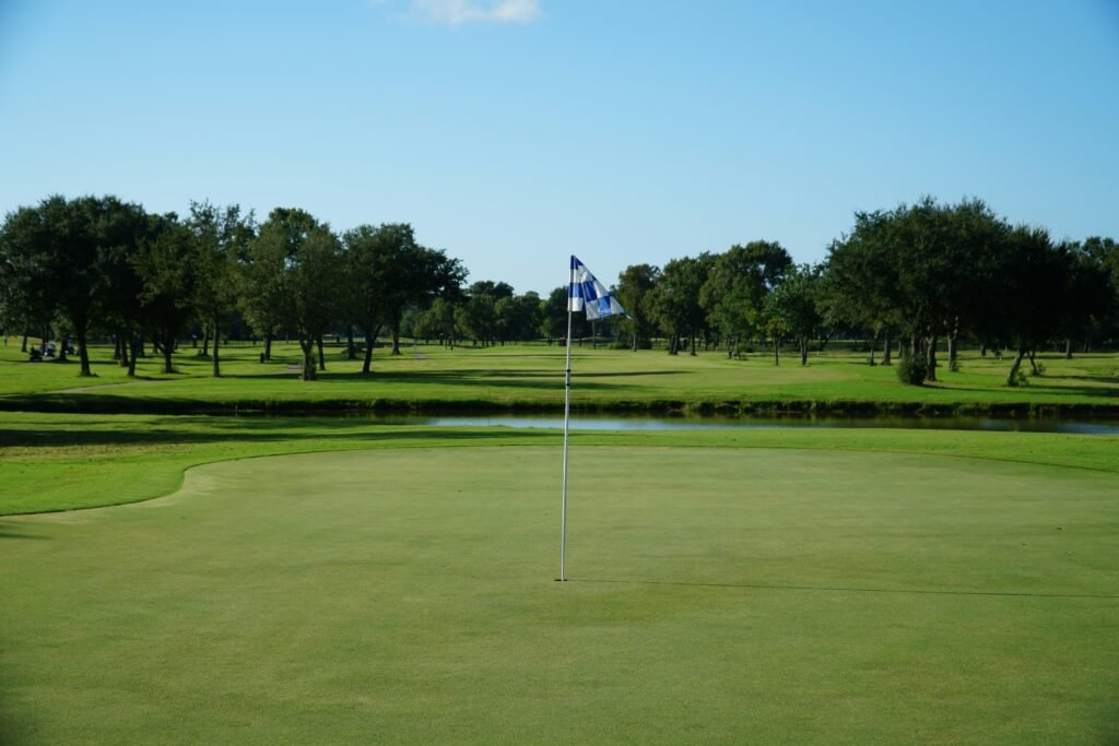 Green golf course and clubhouse setting